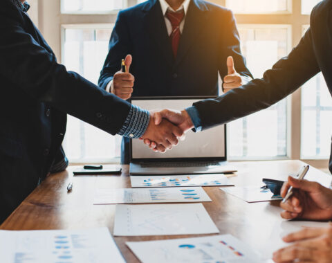 Conflict resolution - two man shaking hands